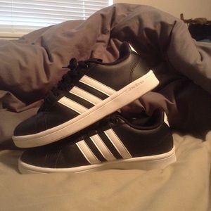 Black and white adidas cloud foam superstars